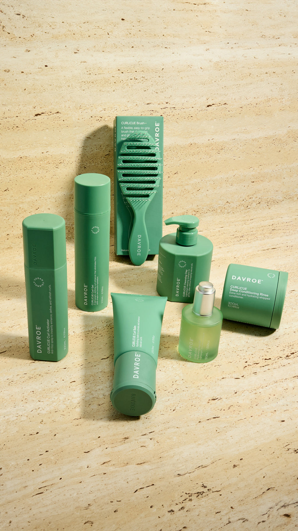 Collection of green haircare products on a wooden surface