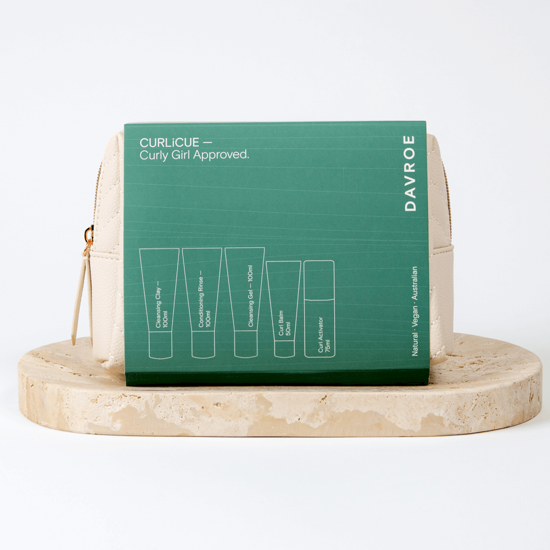 Davroe hair care product packaging on a marble stand with a green label