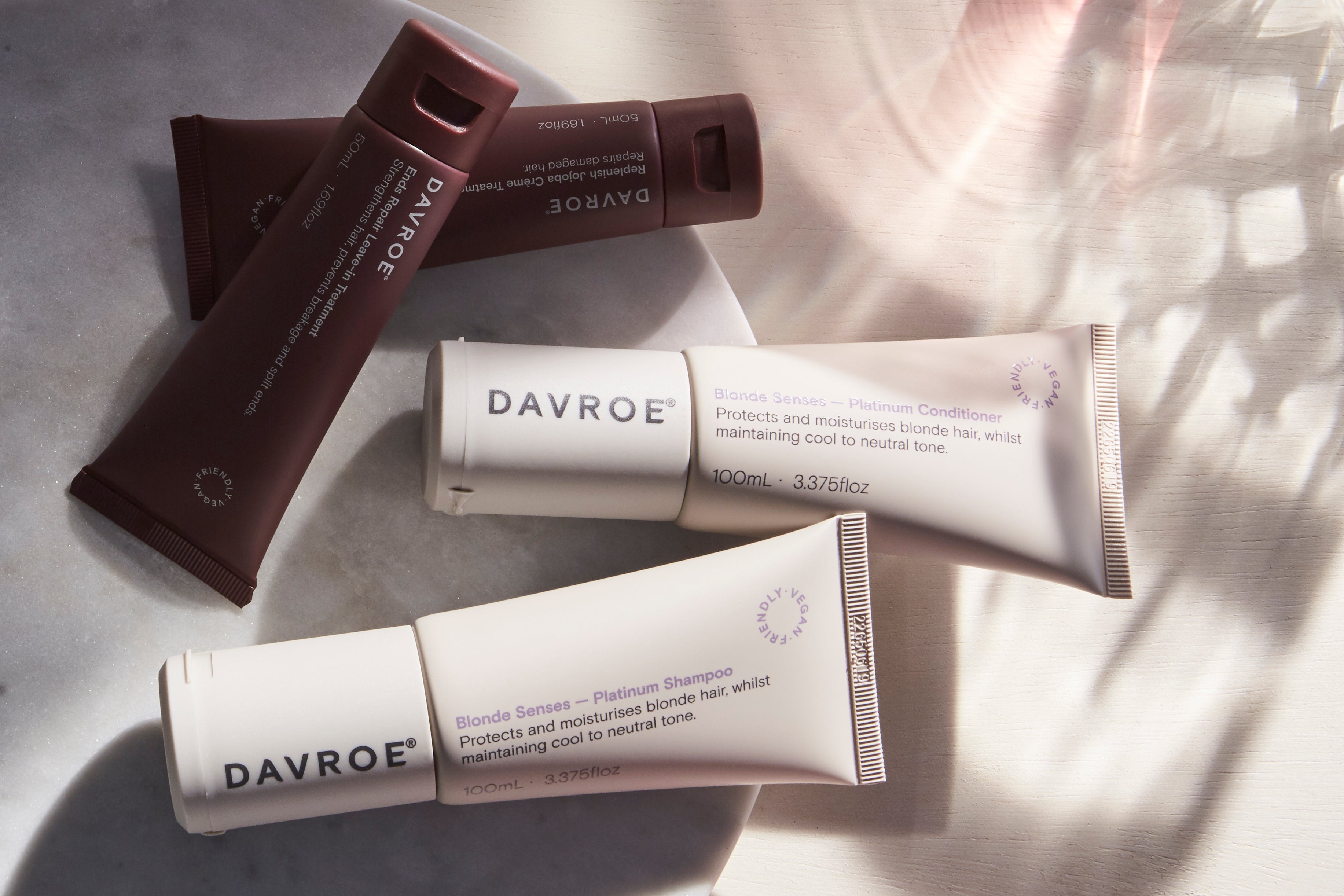 Davroe hair care products on a textured surface